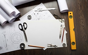 Business Continuity Plans and designs on a table.