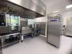 A picture of a kitchen including cookers